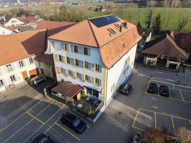 Immeuble d’habitation avec café-restaurant au coeur de la Broye