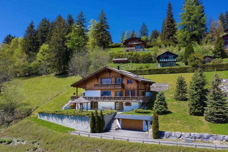 An exceptional chalet nestled in a verdant setting with spectacular views of the Alps