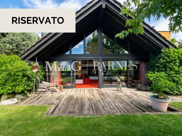 Design villa in Comano with garden and open views, to renovate